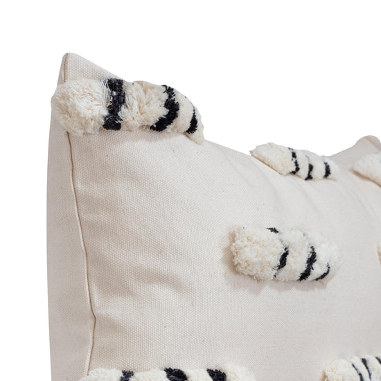 close up of ecru boho style throw pillow, rectangle version
