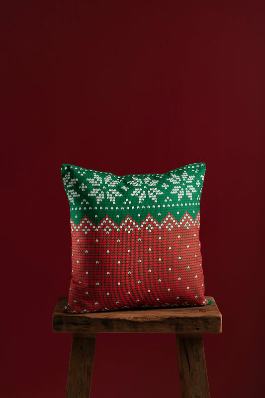 red and gren pillow cover on wooden chair with red backgound.
