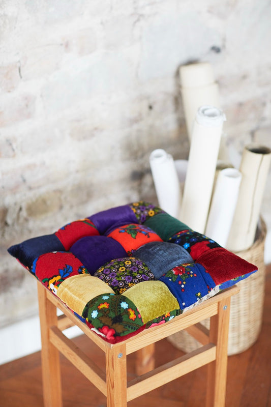 handmade patchwork cushion on wooden chair