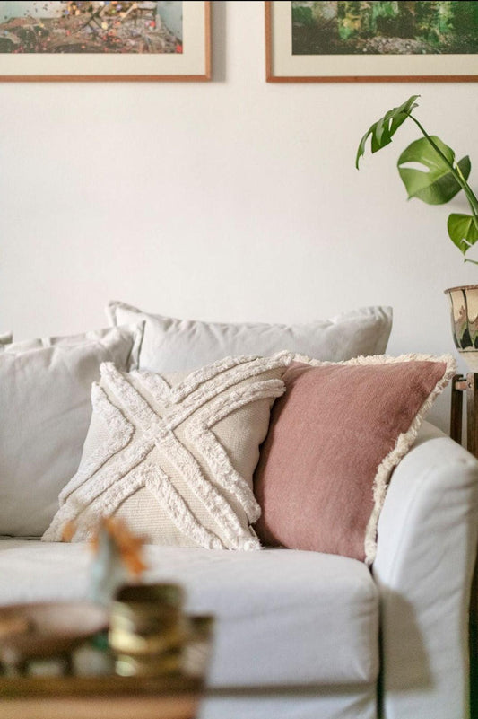 Boho Glenn beige cushion cover with textured cotton design on white sofa