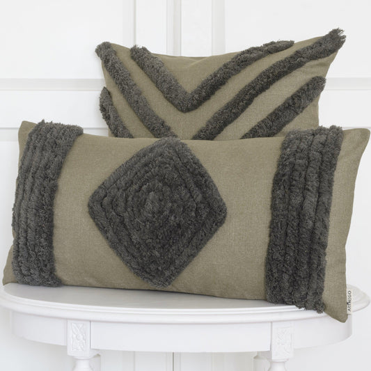 Green Bohemian Darel cushion set with square and rectangular decorative covers on white wooden table