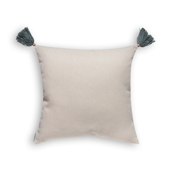 Back view of mint green cotton cushion cover with tassels on white background