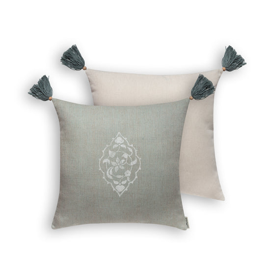 Front and back view of mint green blockprint cushion cover with tassels